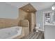 Bathroom features a soaking tub and a tiled standing shower at 3010 Bay Tree Dr, Orlando, FL 32806