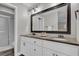 Elegant bathroom featuring double sinks, a large mirror, and modern fixtures for a spa-like experience at 3010 Bay Tree Dr, Orlando, FL 32806