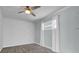 Bedroom featuring hardwood floors, ceiling fan, and bright window with views at 3010 Bay Tree Dr, Orlando, FL 32806