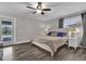 Serene bedroom featuring hardwood floors, neutral walls, and a view of the pool through the glass door at 3010 Bay Tree Dr, Orlando, FL 32806