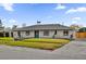 Ranch home with white brick facade and yard at 3010 Bay Tree Dr, Orlando, FL 32806