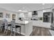 Modern kitchen with white cabinets, quartz countertops, and stainless steel appliances at 3010 Bay Tree Dr, Orlando, FL 32806
