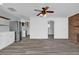 Open concept living room with hardwood floors and a brick fireplace at 3010 Bay Tree Dr, Orlando, FL 32806