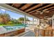 Relaxing covered patio overlooking the pool with comfortable seating at 3010 Bay Tree Dr, Orlando, FL 32806