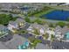 Aerial view showing numerous houses and a lake at 3013 Bonfire Beach Dr # 101, Kissimmee, FL 34746