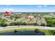 Aerial view showing proximity to community pool and area homes at 3013 Bonfire Beach Dr # 101, Kissimmee, FL 34746