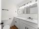 Modern bathroom with double vanity, sleek fixtures, and white cabinetry at 3013 Bonfire Beach Dr # 101, Kissimmee, FL 34746