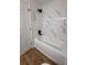 Clean bathroom features white tile wall, a shower head, a bathtub, and a toilet at 3013 Bonfire Beach Dr # 101, Kissimmee, FL 34746
