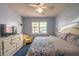 Main bedroom with king bed, ceiling fan, and dresser at 3013 Bonfire Beach Dr # 101, Kissimmee, FL 34746