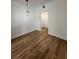 A charming dining room with hardwood floors, modern light fixture, and white trim throughout at 3013 Bonfire Beach Dr # 101, Kissimmee, FL 34746