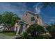 Exterior view of charming light pink house with porch at 3013 Bonfire Beach Dr # 101, Kissimmee, FL 34746