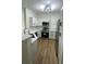 Modern kitchen with stainless steel appliances, white cabinets, and quartz countertops at 3013 Bonfire Beach Dr # 101, Kissimmee, FL 34746