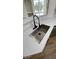 New kitchen sink with quartz countertops and modern style in new home at 3013 Bonfire Beach Dr # 101, Kissimmee, FL 34746