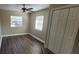 Spacious bedroom with wood-look flooring and a ceiling fan at 305 S Candler Ave, Orlando, FL 32835