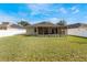 House exterior with screened porch and backyard at 3250 Breakers Way, Orlando, FL 32825