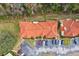 Aerial view of townhouses with parking and a surrounding wooded area at 346 Monroe Cir, Davenport, FL 33896