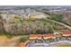 Townhome community nestled in wooded area with a pond nearby at 346 Monroe Cir, Davenport, FL 33896