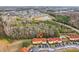 Townhome community nestled in wooded area with a pond nearby at 346 Monroe Cir, Davenport, FL 33896