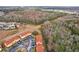 Aerial view of townhouses near a wooded area and community at 346 Monroe Cir, Davenport, FL 33896