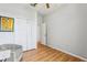 Bright bedroom with wood floors and double door closet at 346 Monroe Cir, Davenport, FL 33896