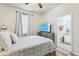 Main bedroom with ensuite bathroom and wood floors at 346 Monroe Cir, Davenport, FL 33896