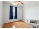 Bright bedroom with wood floors and window coverings at 346 Monroe Cir, Davenport, FL 33896
