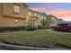 Evening view of townhome community with well-maintained landscaping at 346 Monroe Cir, Davenport, FL 33896