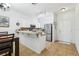 Bright kitchen features stainless steel appliances and a breakfast bar at 346 Monroe Cir, Davenport, FL 33896