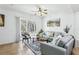 Spacious living room with light grey couches and access to a patio at 346 Monroe Cir, Davenport, FL 33896