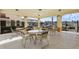 Community patio with tables and chairs for outdoor relaxation at 346 Monroe Cir, Davenport, FL 33896