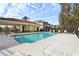 Community pool with lounge chairs and covered patio area at 346 Monroe Cir, Davenport, FL 33896