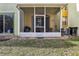 Screened patio, view of the backyard and AC unit at 346 Monroe Cir, Davenport, FL 33896