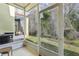 Screened patio with view of backyard and trees at 346 Monroe Cir, Davenport, FL 33896