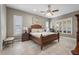 Spacious bedroom with king-size bed and large windows at 35603 Seneca Reserve Dr, Eustis, FL 32736