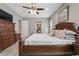 Main bedroom with king-size bed and en-suite bathroom at 35603 Seneca Reserve Dr, Eustis, FL 32736