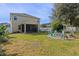 Large backyard with screened porch and fire pit area at 3720 Ryegrass St, Clermont, FL 34714