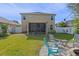Large backyard with screened porch and fire pit area at 3720 Ryegrass St, Clermont, FL 34714