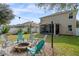 Large backyard with screened porch and fire pit area at 3720 Ryegrass St, Clermont, FL 34714