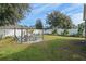 Landscaped backyard with fire pit and seating area at 3720 Ryegrass St, Clermont, FL 34714
