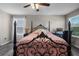 Bedroom with black metal bed frame and pink bedding and home office at 3720 Ryegrass St, Clermont, FL 34714