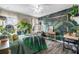 Bedroom with leafy wall mural and hanging chair at 3720 Ryegrass St, Clermont, FL 34714