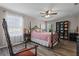 Bedroom with black metal bed frame and pink bedding at 3720 Ryegrass St, Clermont, FL 34714