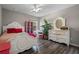 Bedroom with white furniture and pink accents at 3720 Ryegrass St, Clermont, FL 34714