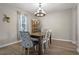 Bright dining room features a chandelier and hardwood floors at 3720 Ryegrass St, Clermont, FL 34714