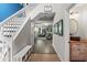 Bright and spacious entryway with staircase and views to living room at 3720 Ryegrass St, Clermont, FL 34714