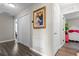 Bright hallway with double doors and wood-look floors at 3720 Ryegrass St, Clermont, FL 34714