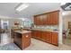 Open kitchen boasts granite countertops and ample cabinetry at 3720 Ryegrass St, Clermont, FL 34714