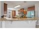 Kitchen features granite countertops and a breakfast bar at 3720 Ryegrass St, Clermont, FL 34714