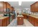 Spacious kitchen with granite countertops and stainless steel appliances at 3720 Ryegrass St, Clermont, FL 34714