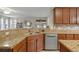Kitchen island with granite countertop and double sink at 3720 Ryegrass St, Clermont, FL 34714